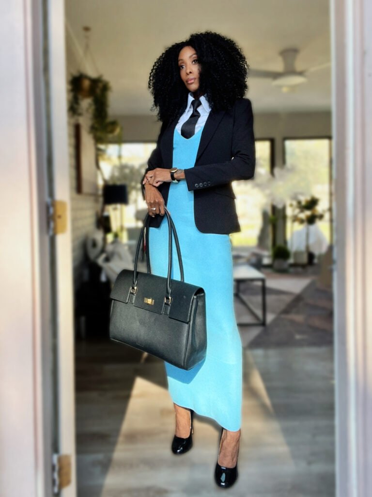 tall africam american woman with a blue maxi dress