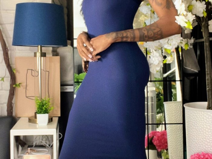 african american woman in a dark navy maxi dress