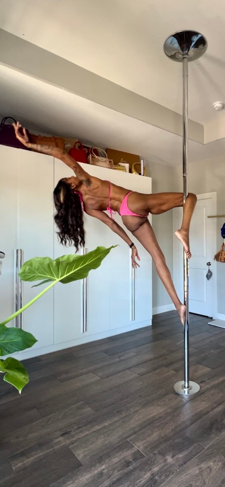 a woman pole dancing