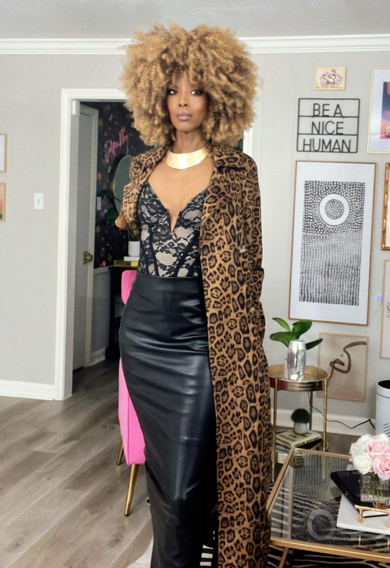 Style photo of African American woman with a leather skirt, lace top and leopard print trench coat