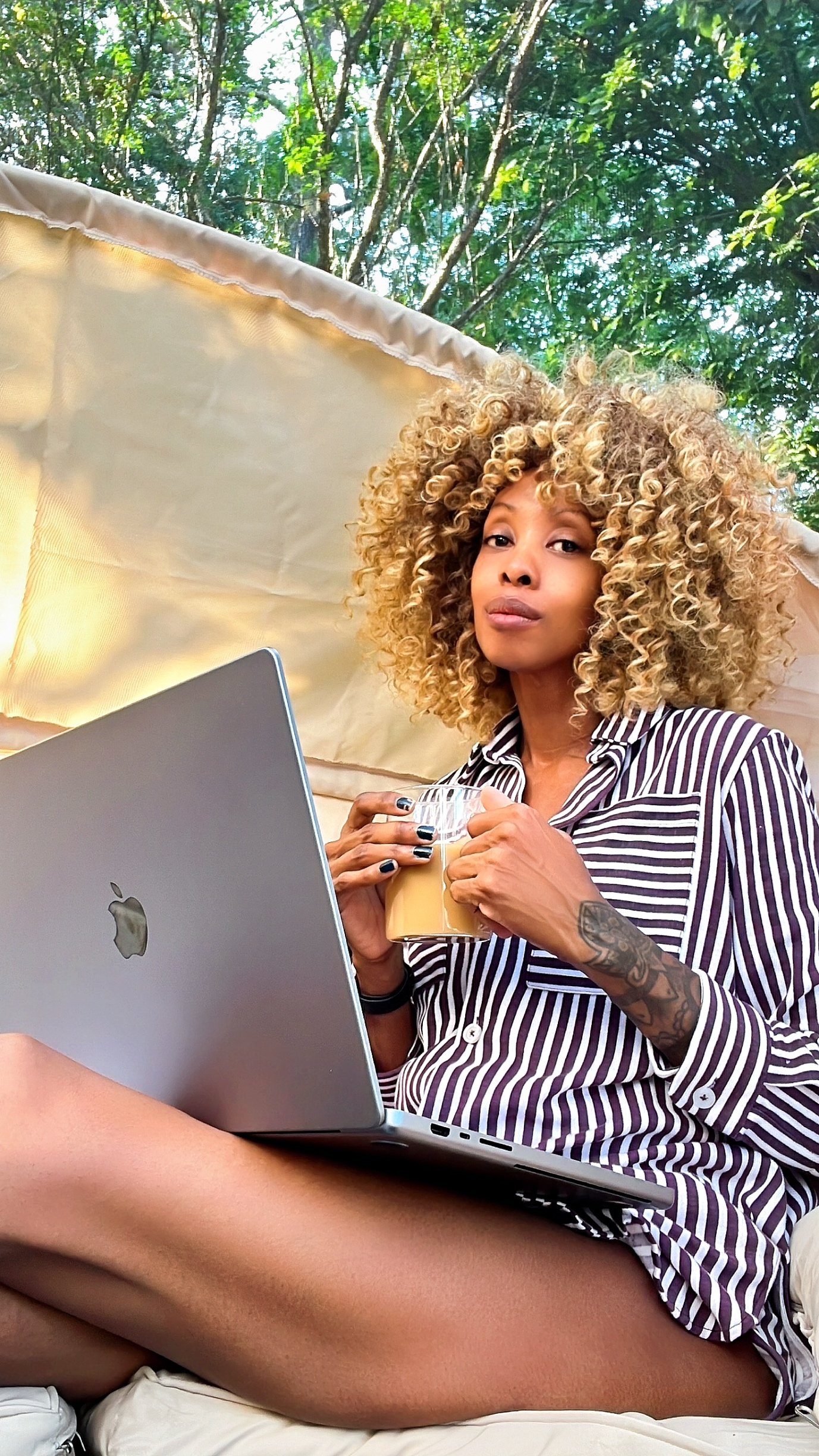 Midlife woman in pajamas drinking coffee while reflecting on emotional healing and self-growth