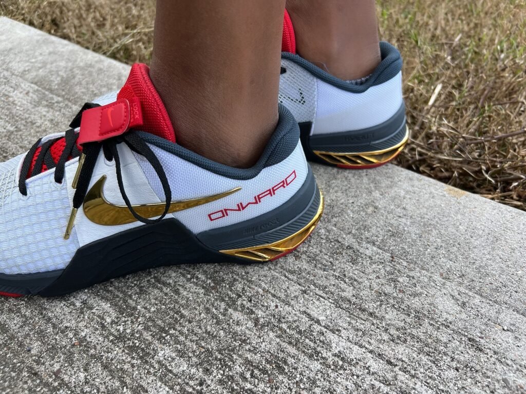 a custom pair of Nike shoes that say onward