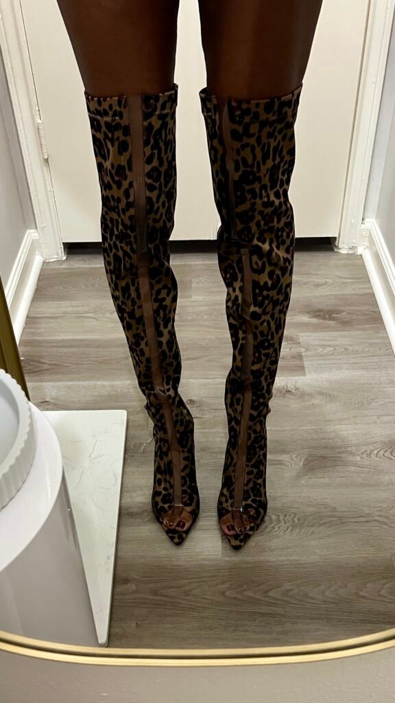 a pair of cheetah print boots for skinny legs