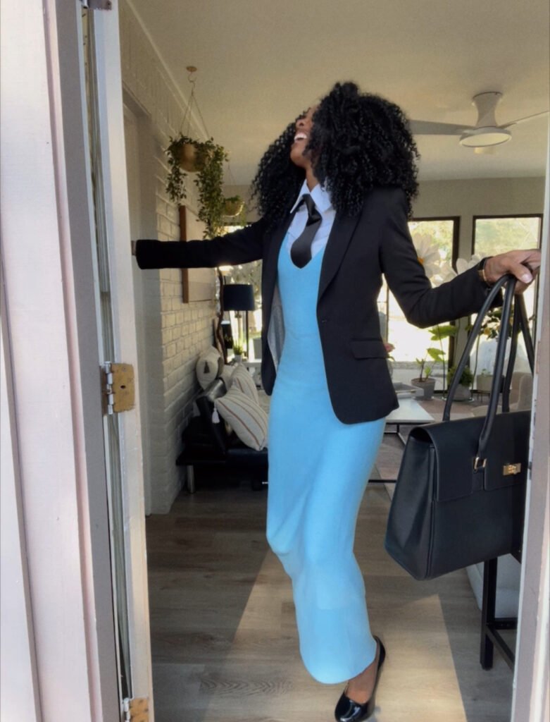 woman in dress and heals stumbling