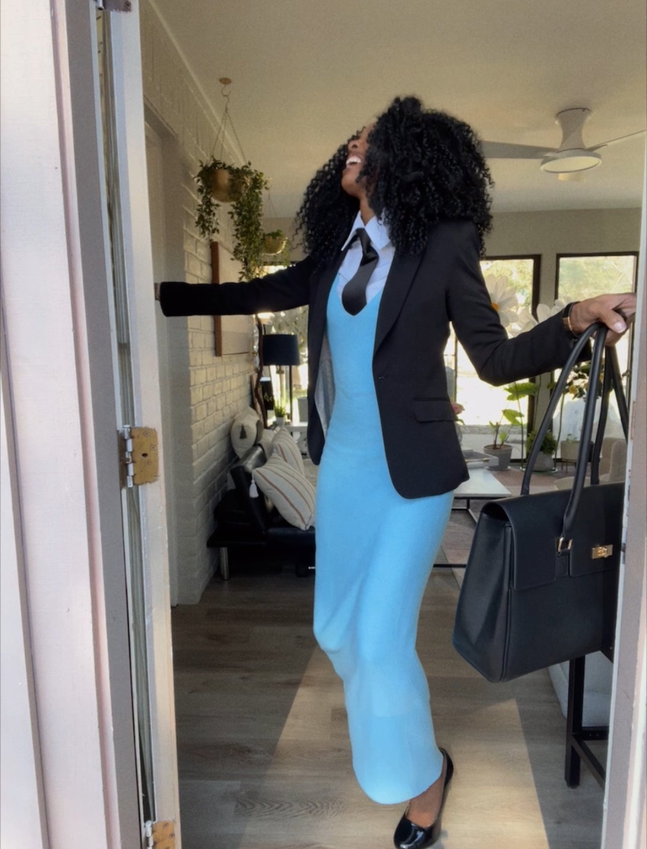 woman in dress and heals stumbling