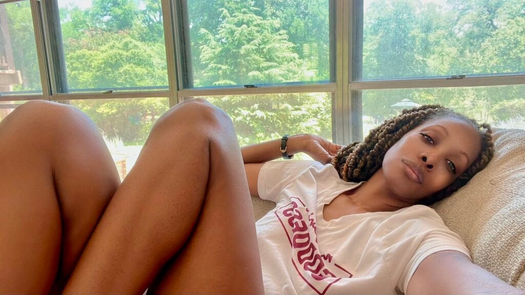 a woman laying on a couch choosing peace over performing