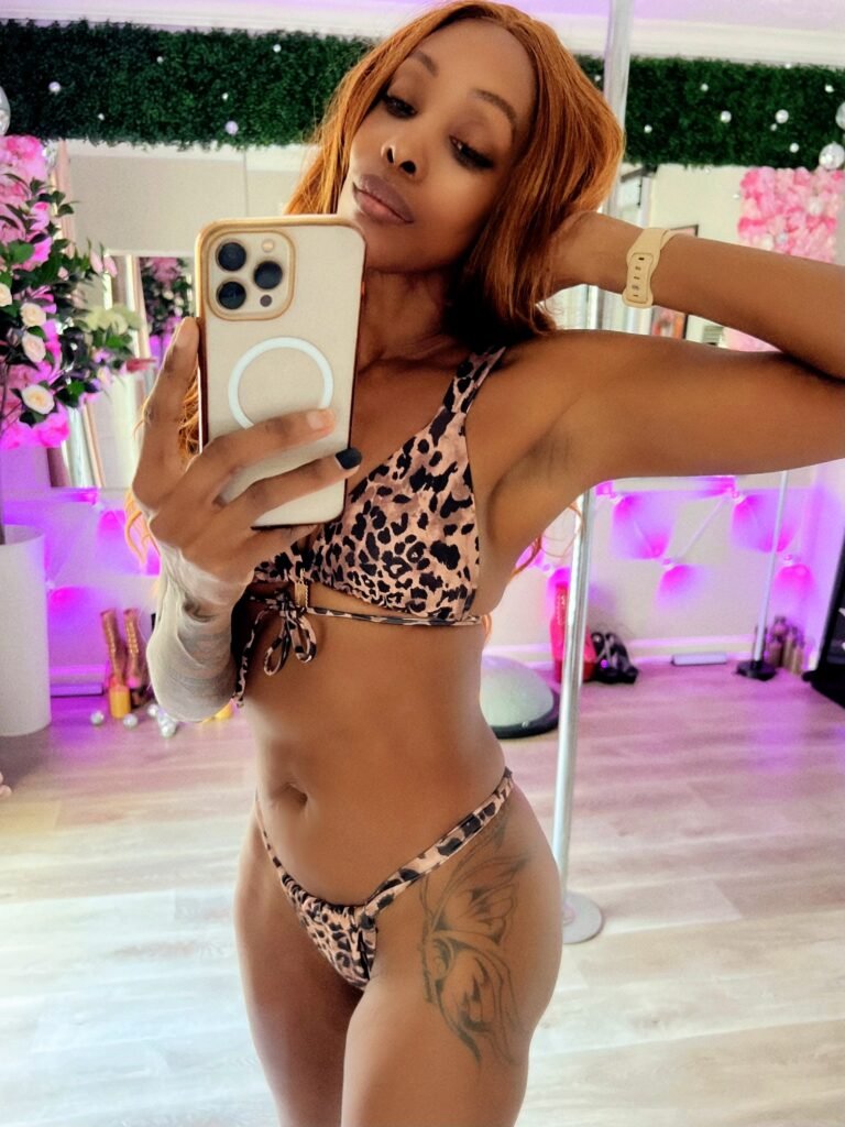 woman with a butterfly tattoo unbecoming herself through transformation